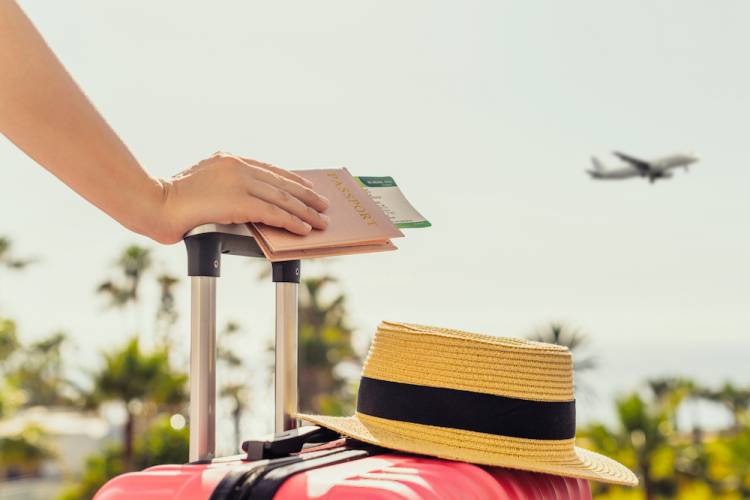 woman with a pink suitcase