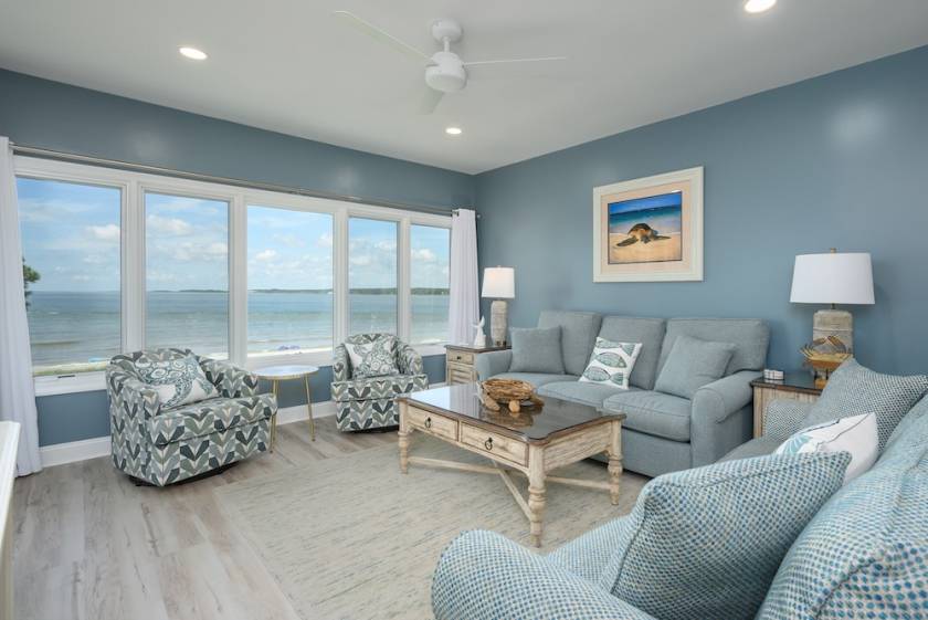 view of ocean through window of hilton head vacation rental