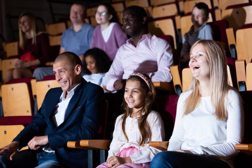 family laughing at show