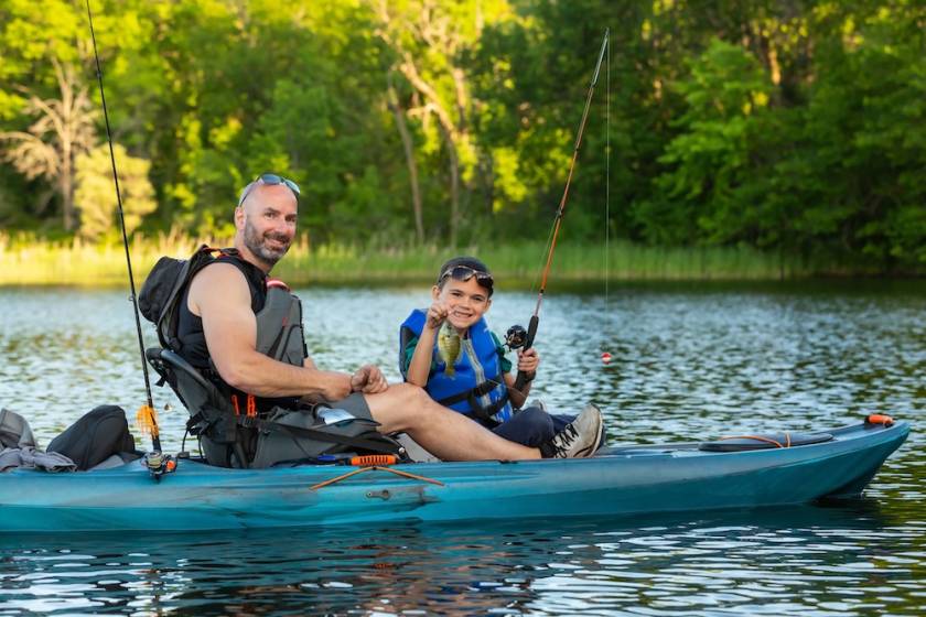 father and son kayak fishing